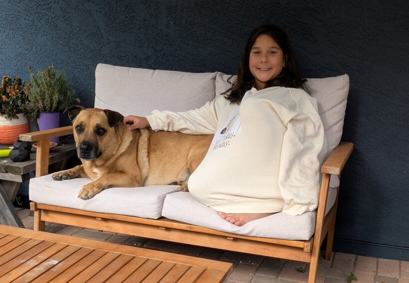 Bruna relaxing with her dog